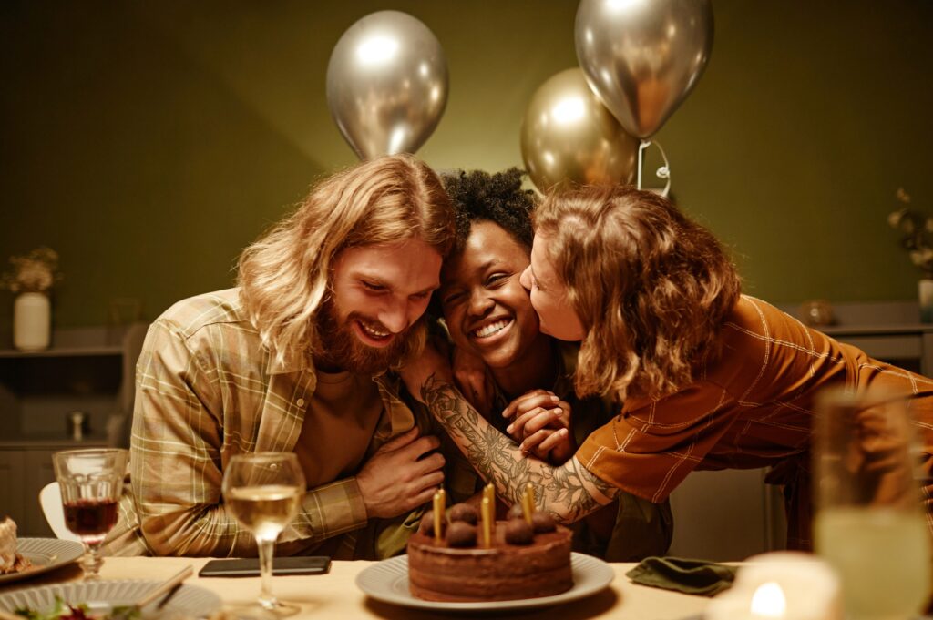 Couple congratulating their friend with birthday
